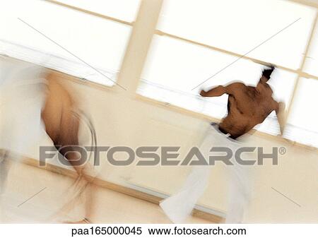 Men performing capoeira, blurred. View Large Photo Image Stock Photography - Men performing capoeira, blurred.. Fotosearch