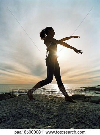 Woman performing tai chi on beach, silhouette. View Large Photo Image Stock Image - Woman performing tai chi on beach, silhouette.. Fotosearch
