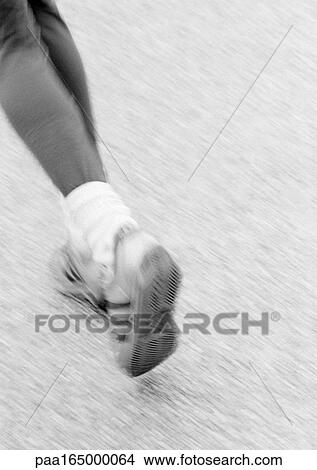 Picture - Woman running, low section.. Fotosearch
