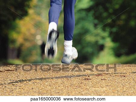 Woman running, lower section View Large Photo Image Stock Photograph - Woman running, lower section. Fotosearch