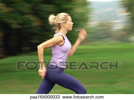 Woman running, side view, blurred. View Large Photo Image Stock Image - Woman running, side view, blurred.. Fotosearch
