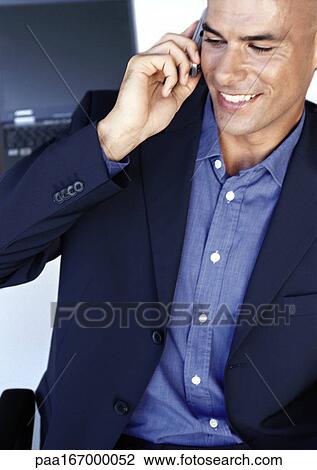 Businessman using cell phone, close-up View Large Photo Image Stock Image - Businessman using cell phone, close-up. Fotosearch
