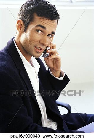 Businessman using cell phone, portrait View Large Photo Image Stock Image - Businessman using cell phone, portrait. Fotosearch