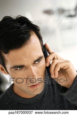 Man using cell phone, close-up View Large Photo Image Stock Photo - Man using cell phone, close-up. Fotosearch