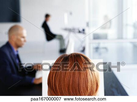 Stock Photo - People working in office. Fotosearch
