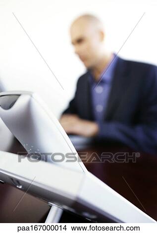 Telephone on businessman's desk, close-up View Large Photo Image Picture - Telephone on businessman's desk, close-up. Fotosearch