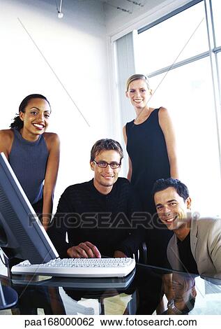 Stock Image - Business people in office, portrait. Fotosearch