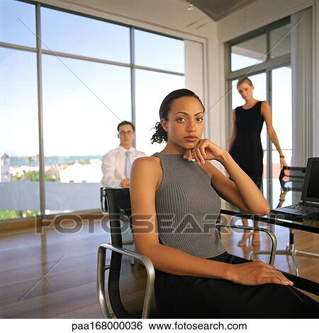 Business people in office, portrait View Large Photo Image Stock Photograph - Business people in office, portrait. Fotosearch