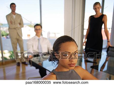 Stock Photography - Business people in office, portrait, blurred. Fotosearch