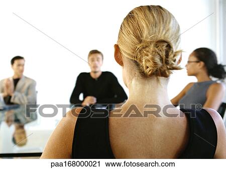 Business people sitting around table View Large Photo Image Stock Image - Business people sitting around table. Fotosearch