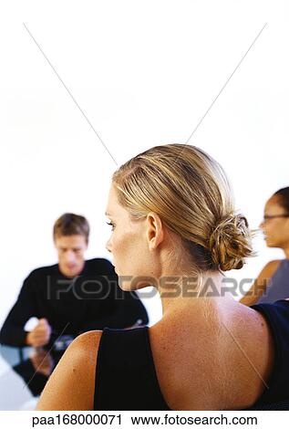 Business people sitting at table View Large Photo Image Stock Image - Business people sitting at table. Fotosearch