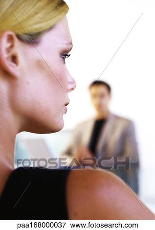 Businessman and woman, close-up of woman's head and shoulder, rear view View Large Photo Image Stock Photo - Businessman and woman, close-up of woman's head and shoulder, rear view. Fotosearch