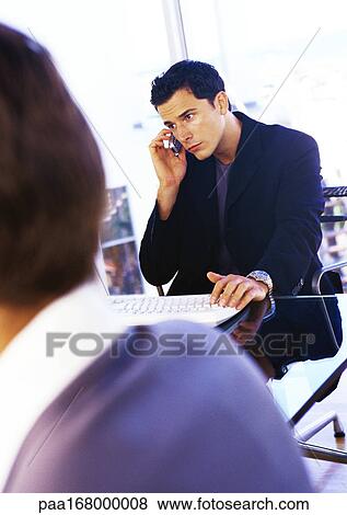 Businessman using cell phone View Large Photo Image Stock Photo - Businessman using cell phone. Fotosearch