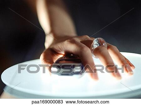 Hand on cell phone, close-up View Large Photo Image Stock Image - Hand on cell phone, close-up. Fotosearch