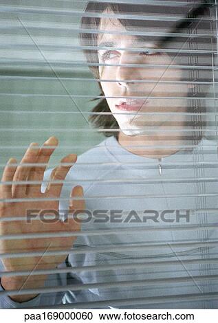 Man leaning against window View Large Photo Image Stock Image - Man leaning against window. Fotosearch