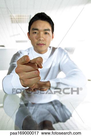 Man pointing at camera, portrait View Large Photo Image Stock Photo - Man pointing at camera, portrait. Fotosearch