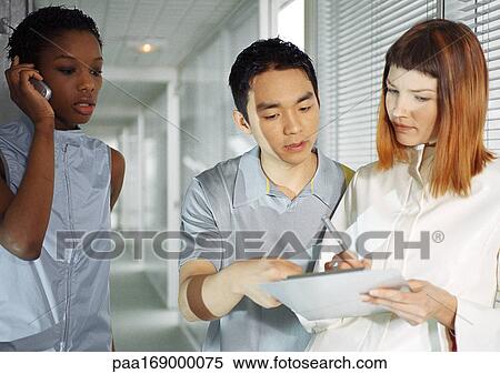 People in hallway, woman using cell phone, waist up View Large Photo Image Stock Photography - People in hallway, woman using cell phone, waist up. Fotosearch