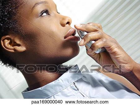 Woman holding futuristic cell phone, close-up, tilt View Large Photo Image Stock Image - Woman holding futuristic cell phone, close-up, tilt. Fotosearch