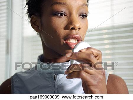 Woman holding futuristic cell phone, close-up View Large Photo Image Stock Photo - Woman holding futuristic cell phone, close-up. Fotosearch
