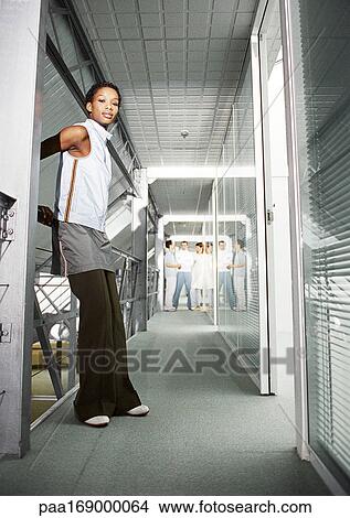 Picture - Woman in hallway, portrait. Fotosearch