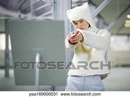 Woman wearing fleecy hooded sweater, portrait View Large Photo Image Stock Image - Woman wearing fleecy hooded sweater, portrait. Fotosearch
