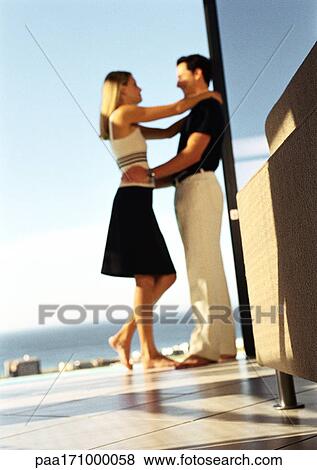 Couple hugging, side view View Large Photo Image Stock Photo - Couple hugging, side view. Fotosearch