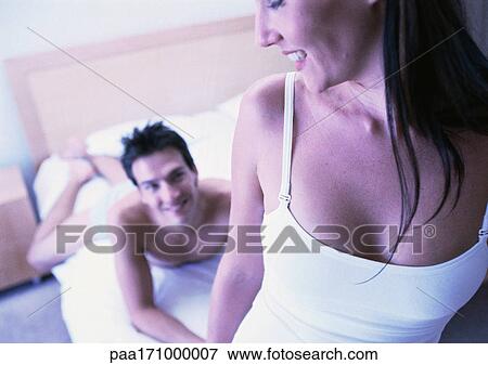 Couple in bedroom, smiling View Large Photo Image Stock Photo - Couple in bedroom, smiling. Fotosearch