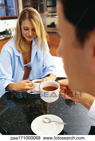 Man and woman having tea View Large Photo Image Stock Photo - Man and woman having tea. Fotosearch