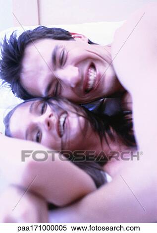 Man and woman hugging in bed, close-up View Large Photo Image Stock Photography - Man and woman hugging in bed, close-up. Fotosearch