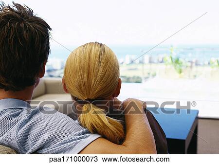 Man with arm on woman's shoulder, rear view, close-up View Large Photo Image Stock Image - Man with arm on woman's shoulder, rear view, close-up. Fotosearch