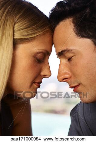 Woman and man forehead to forehead, eyes closed, close-up View Large Photo Image Picture - Woman and man forehead to forehead, eyes closed, close-up. Fotosearch