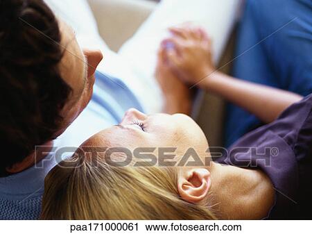Woman leaning head on man's shoulder, close-up View Large Photo Image Stock Image - Woman leaning head on man's shoulder, close-up. Fotosearch