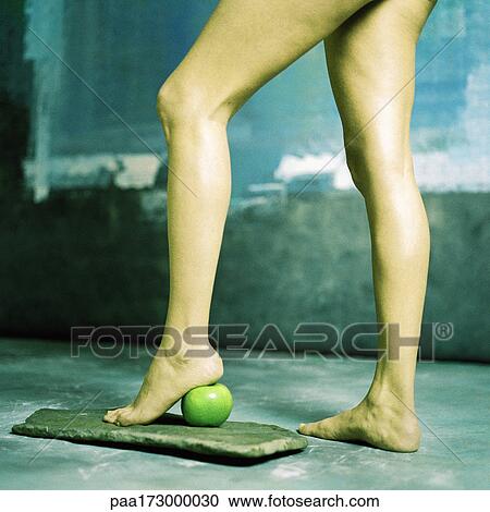 Woman's legs, heel on apple, low section View Large Photo Image Stock Image - Woman's legs, heel on apple, low section. Fotosearch
