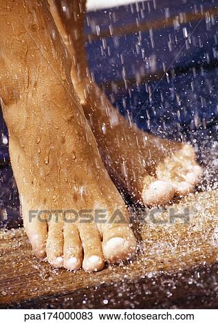 Feet under shower, close-up View Large Photo Image Stock Image - Feet under shower, close-up. Fotosearch