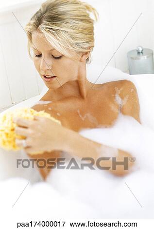 Stock Photo - Woman in bathtub, head and shoulders. Fotosearch