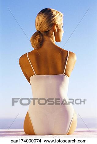 Woman in one-piece bathing suit, rear view, close-up View Large Photo Image Picture - Woman in one-piece bathing suit, rear view, close-up. Fotosearch