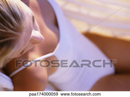 Woman in swimsuit, sitting, elevated view View Large Photo Image Stock Photo - Woman in swimsuit, sitting, elevated view. Fotosearch