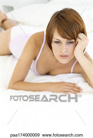Stock Photo - Woman lying on stomach. Fotosearch