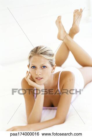 Woman lying on stomach View Large Photo Image Stock Photograph - Woman lying on stomach. Fotosearch