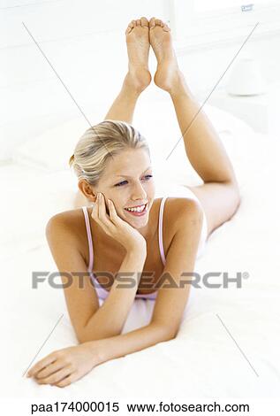 Woman lying on stomach View Large Photo Image Stock Photography - Woman lying on stomach. Fotosearch