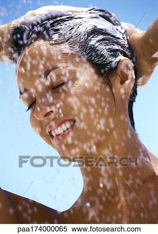 Woman shampooing hair, eyes closed, close-up View Large Photo Image Stock Photography - Woman shampooing hair, eyes closed, close-up. Fotosearch