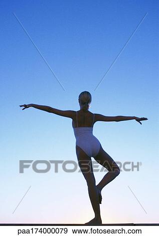 Woman standing in dancing pose, rear view View Large Photo Image Stock Photo - Woman standing in dancing pose, rear view. Fotosearch