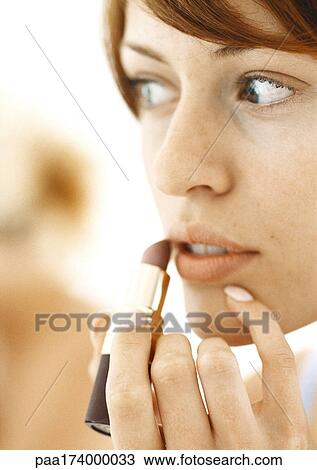 Woman using lipstick, close-up View Large Photo Image Stock Image - Woman using lipstick, close-up. Fotosearch