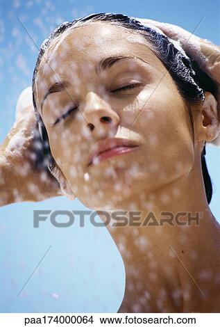 Woman with eyes closed, shampooing hair, close-up View Large Photo Image Picture - Woman with eyes closed, shampooing hair, close-up. Fotosearch