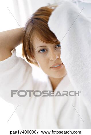 Woman with hands behind head, portrait, close-up View Large Photo Image Stock Photo - Woman with hands behind head, portrait, close-up. Fotosearch