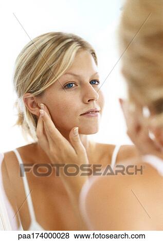 Woman's reflection in mirror, head and shoulders View Large Photo Image Stock Photo - Woman's reflection in mirror, head and shoulders. Fotosearch