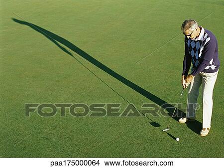 Mature golfer, elevated view View Large Photo Image Picture - Mature golfer, elevated view. Fotosearch