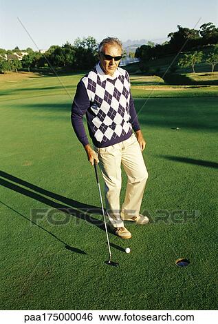 Mature man playing golf View Large Photo Image Stock Photograph - Mature man playing golf. Fotosearch