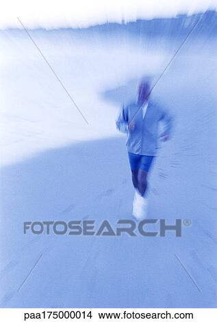 Mature man running on beach, blurred View Large Photo Image Picture - Mature man running on beach, blurred. Fotosearch