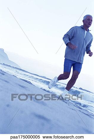 Mature man running on beach View Large Photo Image Stock Photography - Mature man running on beach. Fotosearch